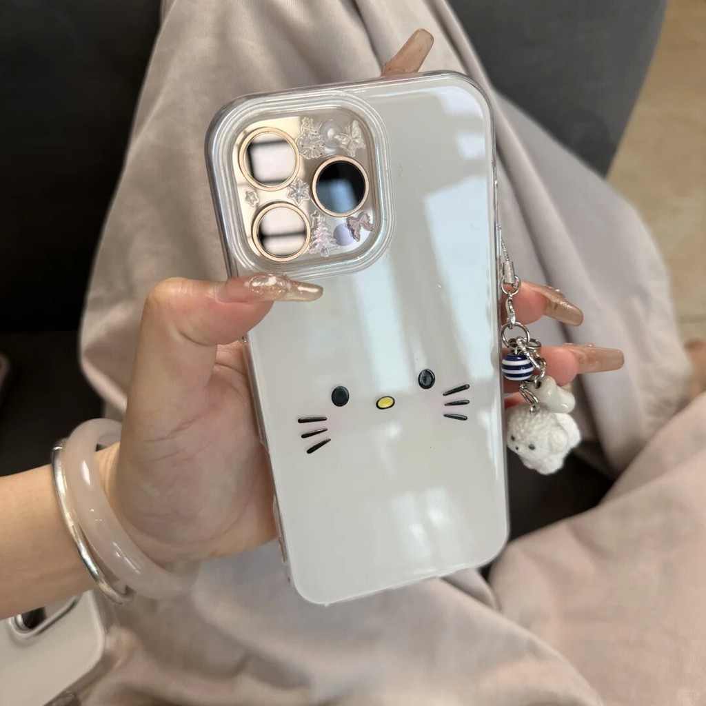 Huiwanju น่ารักและเรียบง่าย kt cat sํานวนตุ๊กตาลูกสุนัขจี้เคสโทรศัพท์มือถือเหมาะสําหรับ iPhone 16promax การ์ตูน kt cat 15pro ตุ๊กตาสุนัขจี้โซ่ 14/13 เคสป้องกัน