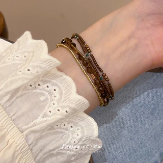 เดรช สร้อยข้อมือลูกปัดแก้วหลายชั้นสไตล์ชาติพันธุ์ย้อนยุคที่ทันสมัยและง่ายต่อการจับคู่สร้อยข้อมือตกแต่งมือที่เรียบง่