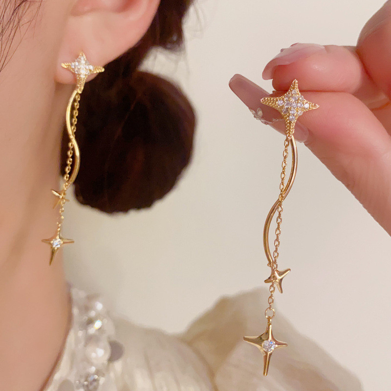 เวอร์ชั่นเกาหลีอารมณ์แฟชั่นดาวยาวพู่เฉพาะแสงหรูหราออกแบบต่างหูขายส่ง