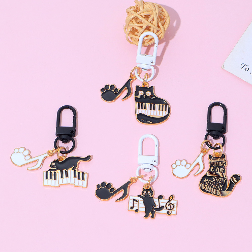 Creative Musical Cat พวงกุญแจแฟชั่น Kitty พวงกุญแจโลหะหูฟังจี้ของขวัญของที่ระลึก