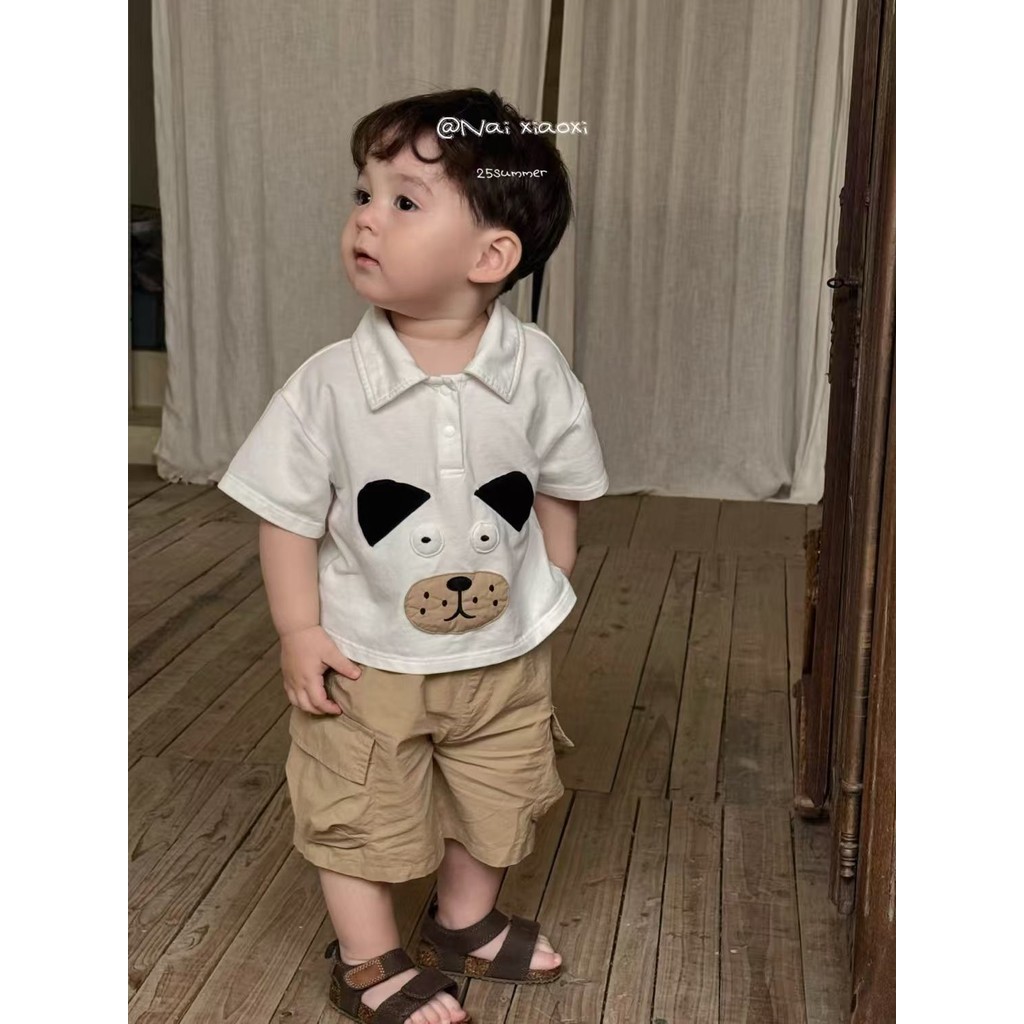 ชุดเด็กผู้ชาย 2025 ใหม่การ์ตูนพิมพ์ลูกสุนัขน่ารักออกแบบเสื้อสีทึบ + กางเกงขาสั้นคาร์โก้บางชุดสองชิ้น