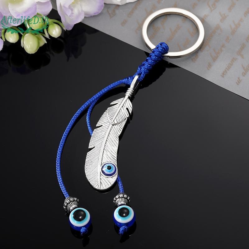AF Lucky Eye Alloy Feather พวงกุญแจสีฟ้าตุรกี Evil Eye Key Chain กระเป๋าพวงกุญแจรถสําหรับผู้หญิงผู้ชายเครื่องประดับของขวัญ A