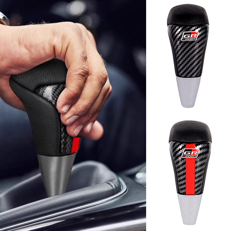 กรัม ทีร์ กีฬารถจัดแต่งทรงผมเกียร์เปลี่ยนลูกบิดอลูมิเนียมคาร์บอนไฟเบอร์หนังสีแดง/สีดําสําหรับ