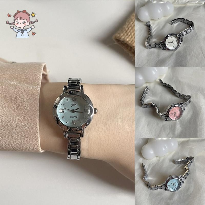 นาฬิกาข้อมือสตรีทรงกลมขนาดเล็กเรียบง่ายหรูหราอเนกประสงค์ลายทางนาฬิกาควอทซ์เหล็กสําหรับผู้หญิง