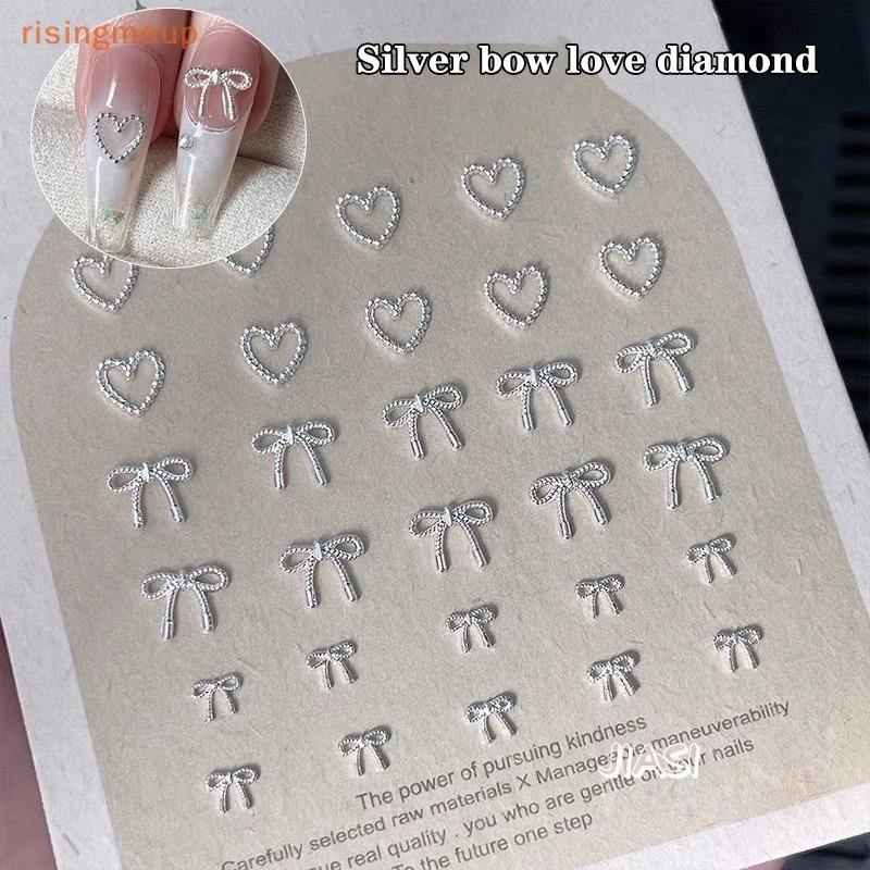 [risingmeup] 10 ชิ้นโลหะผสม Bowknot Love Nails Art Charms ตกแต่ง 3D โลหะหรูหรา Silver Bows รูป Jewellery DIY เล็บออกแบบอุปกรณ์ใหม่