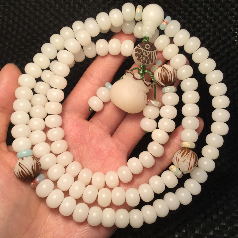สร้อยข้อมือรากบอดีจากหยกขาว เมล็ดแท้ 108 เม็ด เมล็ดบอดีแท้ สร้อยข้อมือสำหรับผู้ชายและผู้หญิง คู่รัก
