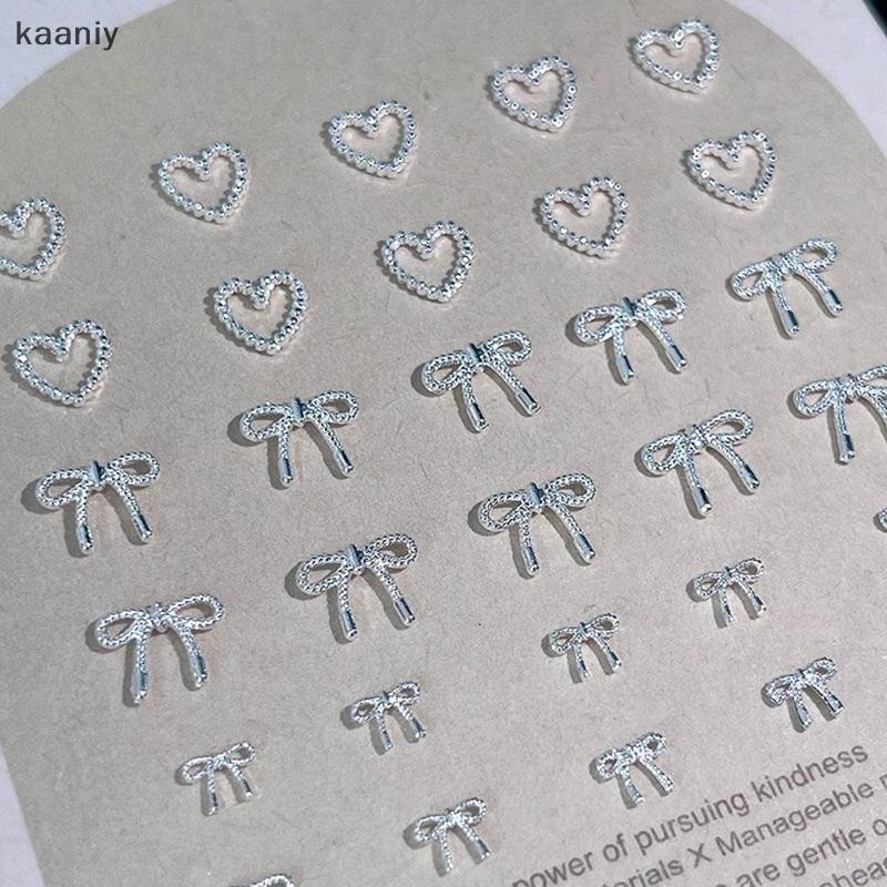 [KAN] 10pcs Alloy Bowknot Love Nails Art Charms ตกแต่ง 3D โลหะหรูหรา Silver Bows รูป Jewellery DIY เล็บออกแบบอุปกรณ์ FXH