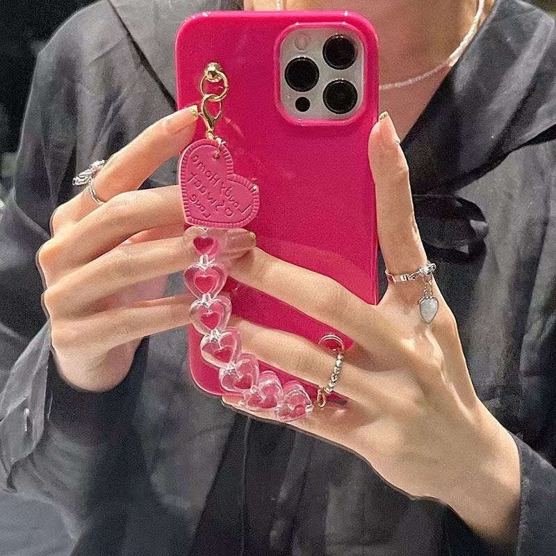 ตุ๊กตาบาร์บี้สีชมพูแฟชั่นและเรียบง่ายคริสตัลหัวใจสายรัดข้อมือสร้อยข้อมือเคสนิ่มป้องกันการหล่นสําหรับ ไอโฟน 16โปรแม็กซ์ 16 15 14 13 12 11 มือโปร สูงสุด 16บวก 14 15 บวกกร