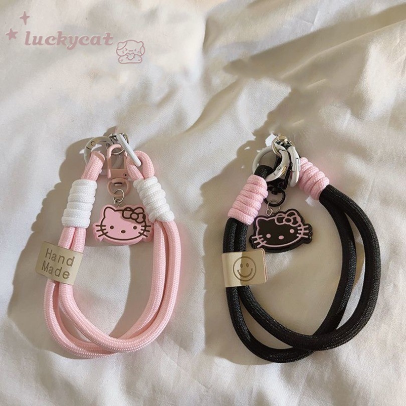 Ins น่ารักสีชมพูและสีดํา Mini KT แมวโทรศัพท์แหวนโทรศัพท์ Lanyard Key Lanyard ป้องกันอุปกรณ์เสริมโทรศัพท์