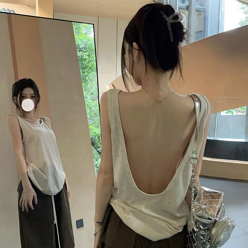 เสื้อกล้ามแขนกุดเปลือยหลังสีทึบสไตล์อเมริกันฤดูร้อนสําหรับผู้หญิงพร้อมดีไซน์ทรงหลวม