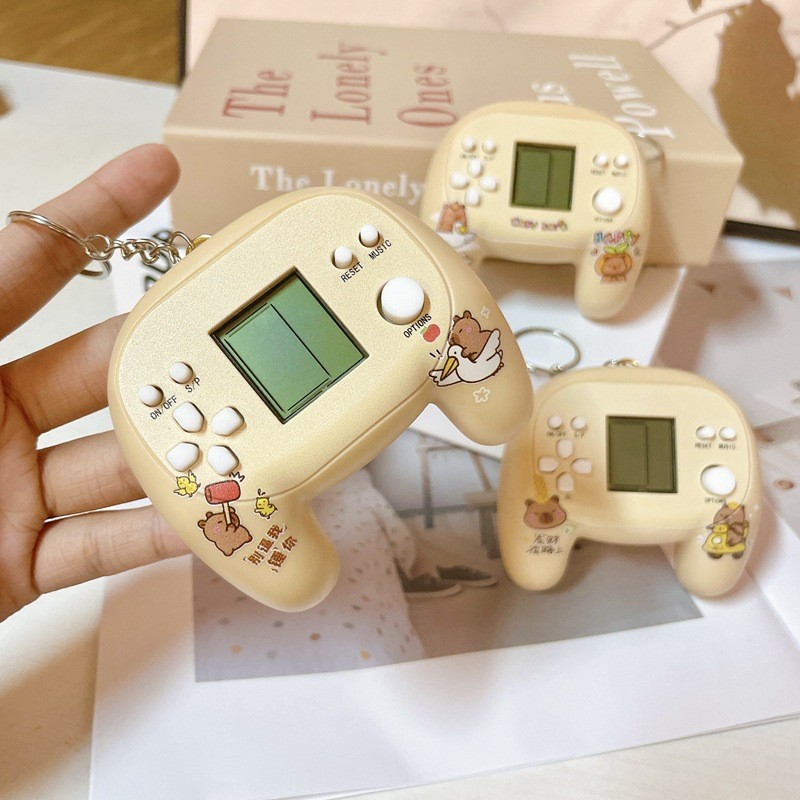 มือถือ Mini Tetris Controller เกมคอนโซล Kapibala ของเล่น Dolphin พวงกุญแจของขวัญเกม