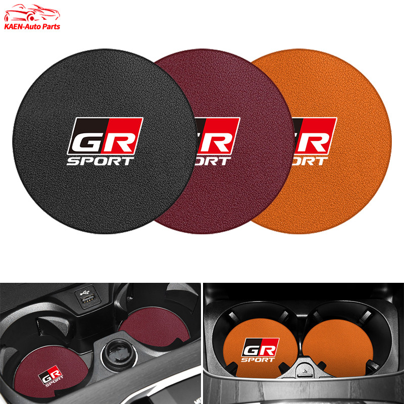 ตกแต่งบ้าน 1ชิ้น สำหรับ Toyota แผ่นรองแก้วน้ําในรถยนต์ หนังแผ่นรองแก้วน้ําในรถยนต์ แผ่นรองแก้วน้ำในรถ​​ กันลื่น แผ่นรองแก้วเครื่องดื่ม Toyota GR 86 Yaris Corolla Cross Altis Supra CHR Wish bZ4X Vios Sienta Avanza Fortuner Camry Hilux Revo Yaris ATIV Yaris Cross ส่งด่วน สั่งเลย