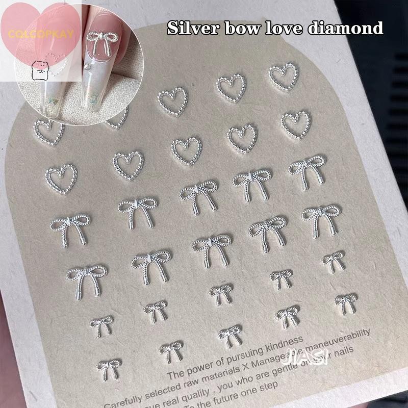 HANHAI 10pcs โลหะผสม Bowknot Love เล็บ Art Charms ตกแต่ง 3D โลหะหรูหรา Silver Bows รูป Jewellery DIY เล็บออกแบบอุปกรณ์ TH