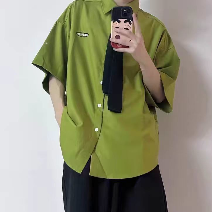 เสื้อแขนสั้นสีเขียวการ์ตูน Nick Fox เสื้อลายคลายหลวม
