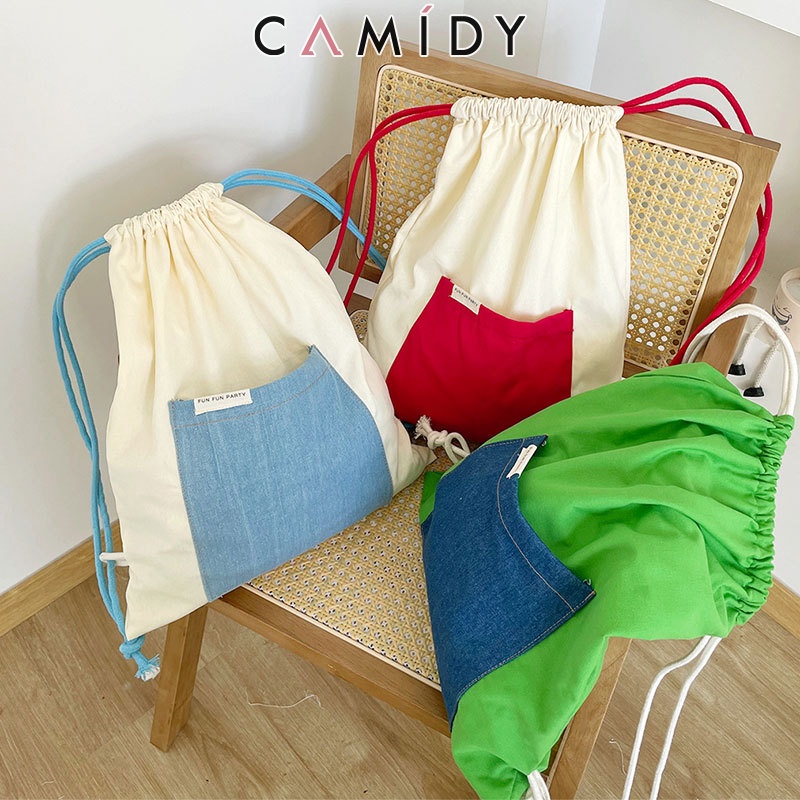 Camidy เวอร์ชั่นเกาหลีของสีคอนทราสต์กระเป๋าเป้สะพายหลังแบบเชือกรูดผ้าใบกระเป๋าเดินทางแบบรูดเชือกกลางแจ้งขี่จักรยานกีฬากระเป๋าเป้สะพายหลังกระเป๋านักเรียนนักเรียน