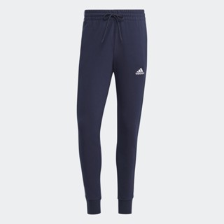 adidas ไลฟ์สไตล์ กางเกงขายาว Essentials French Terry Tapered Cuff 3-Stripes ผู้ชาย สีน้ำเงิน IC9406