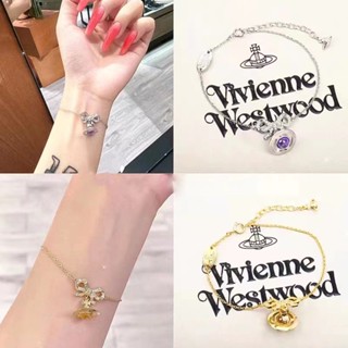 Westwood สร้อยข้อมือ จี้โบว์ สีม่วง ดาวเสาร์ สามมิติ จี้ดาวเคราะห์ วิเวียน แชมเปญ ดาวเคราะห์ หรูหรา สําหรับผู้หญิง