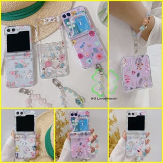 เคสโทรศัพท์มือถือแบบแข็ง ใส กันกระแทก ลายดอกไม้ พร้อมสร้อยข้อมือ ลูกปัด สําหรับ Samsung Galaxy Z Flip 5 Z Flip 4 Z Flip 3