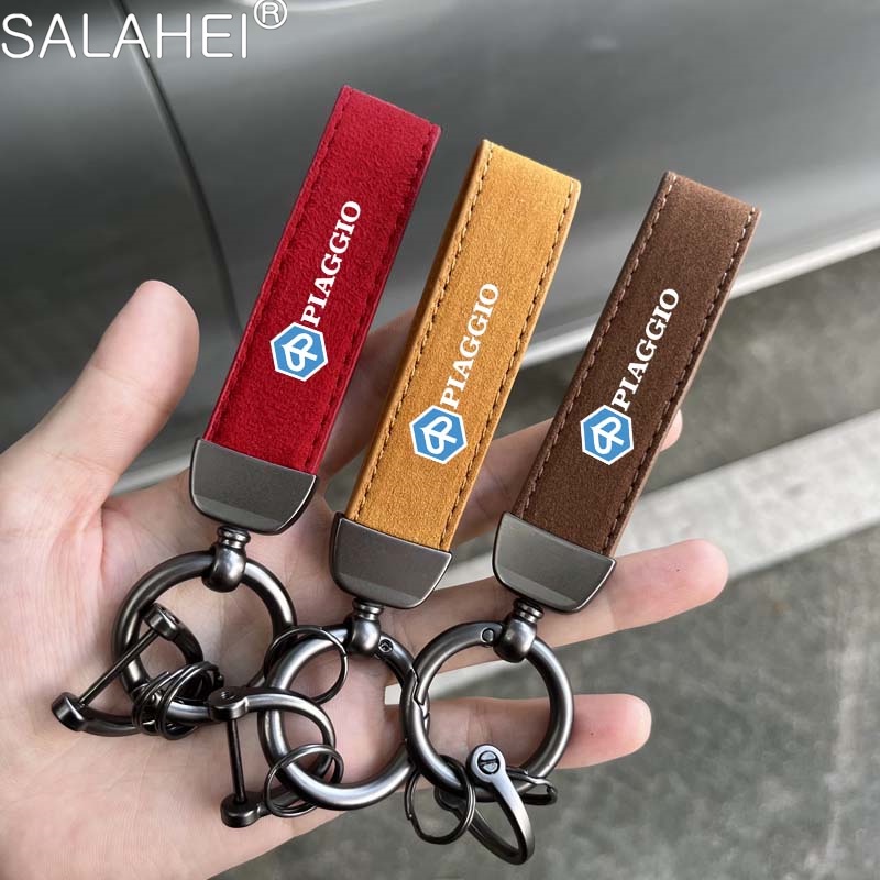 โลหะรถจักรยานยนต์จัดแต่งทรงผมสัญลักษณ์พวงกุญแจ Suede Key แหวนสําหรับ Piaggio Vespa GTS 250 300 Sprint Primavera 150 LX15 S150 อุปกรณ์เสริม