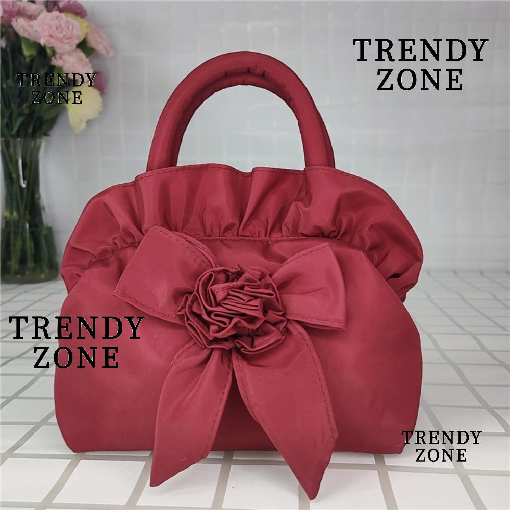 Trendyzone กระเป๋าถือ ใส่โทรศัพท์มือถือ ประดับโบว์ มีซิป สีพื้น แฟชั่นฤดูร้อน สําหรับสตรี