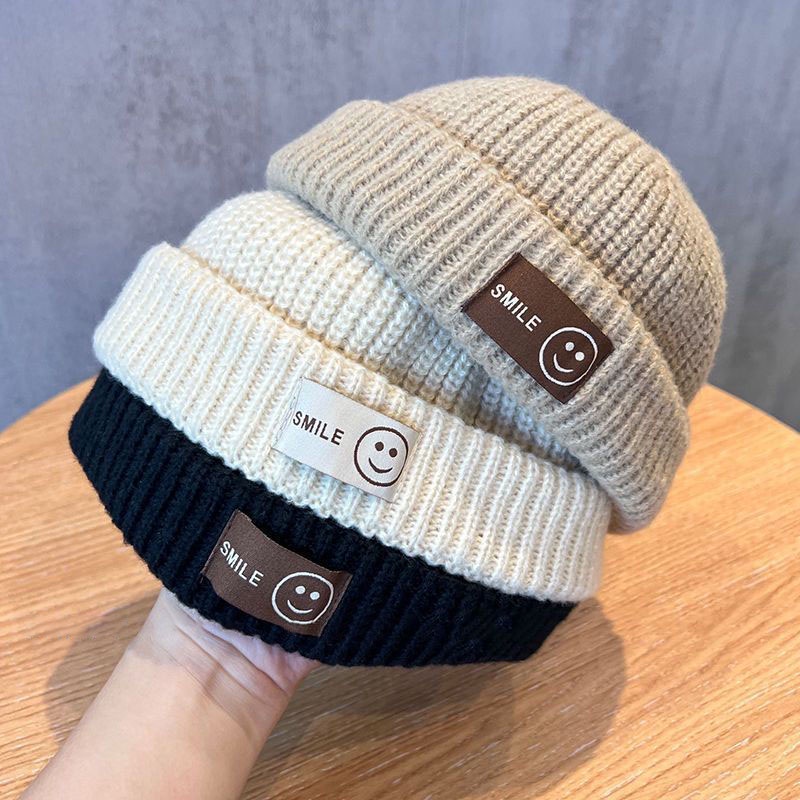 หมวกบีนนี่ ผ้าถัก แบบนิ่ม ป้องกันหู ลายหน้ายิ้ม สีพื้น ให้ความอบอุ่น แฟชั่นฤดูใบไม้ร่วง และฤดูหนาว สําหรับเด็กผู้ชาย และเด็กผู้หญิง อายุ 1-5 ปี