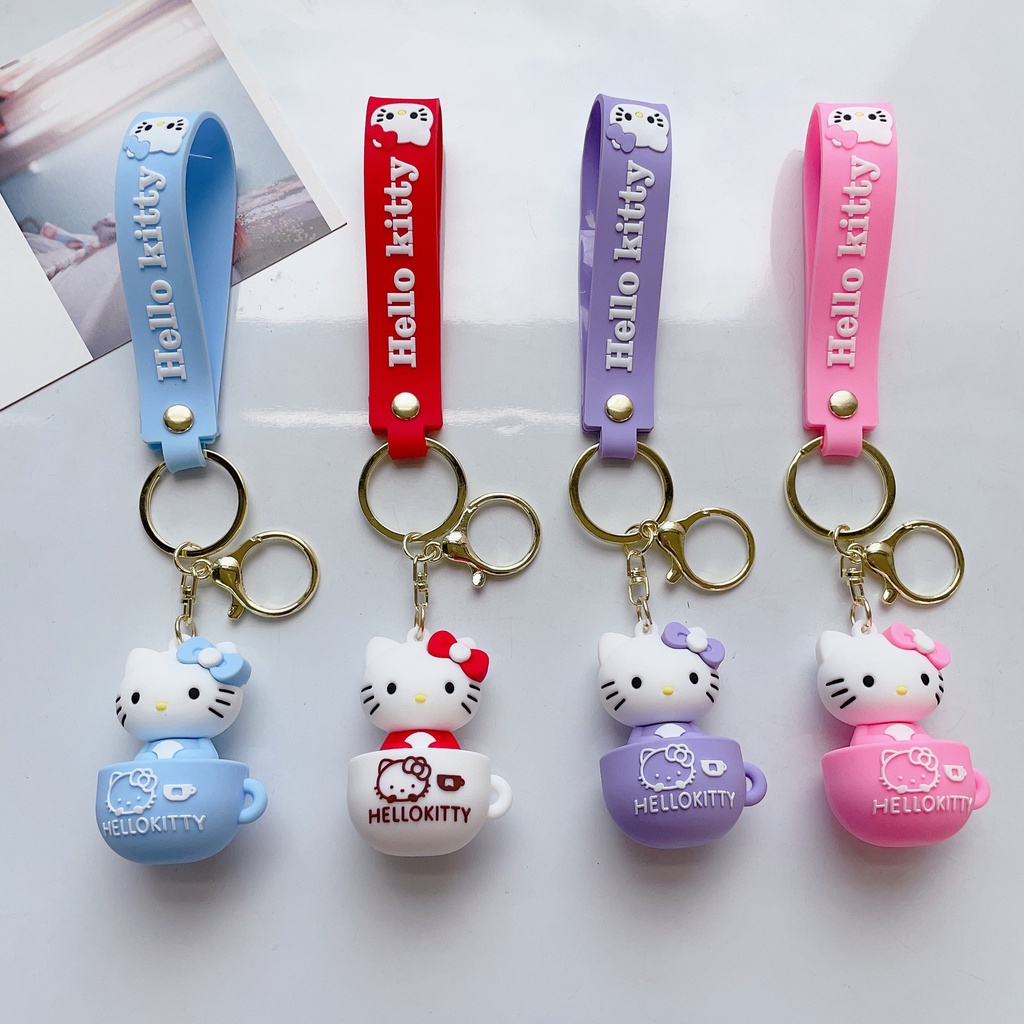 สไตล์ใหม่ ถ้วยกาแฟ KT พวงกุญแจแมวน่ารัก Hello Kitty ตุ๊กตากระเป๋านักเรียนจี้พวงกุญแจรถจี้ขายส่ง