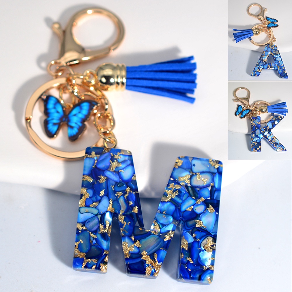 พวงกุญแจเรซิ่น จี้รูปผีเสื้อ ประดับพู่ 26 Initials สีฟ้า สําหรับผู้หญิง และผู้ชาย