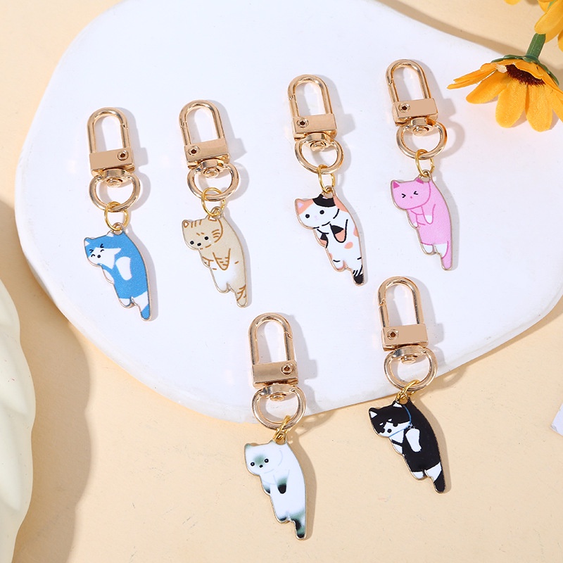 พวงกุญแจโลหะ จี้อุ้งเท้าแมวน่ารัก สีสันสดใส เครื่องประดับ สําหรับผู้หญิง เด็กผู้หญิง รถ กระเป๋าสตางค์ หูฟัง เคสโทรศัพท์