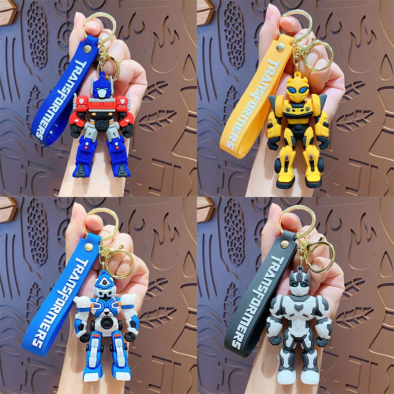 พวงกุญแจซิลิโคน จี้ตุ๊กตาการ์ตูนอนิเมะ Transformers Optimus Prime Bumblebee สามมิติ ของเล่นสําหรับเด็ก