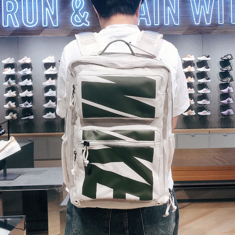 Nike NIKE MAX AIR Sports Air Cushion Backpack กระเป๋าเป้สะพายหลังคอมพิวเตอร์กระเป๋านักเรียนนักเรียน