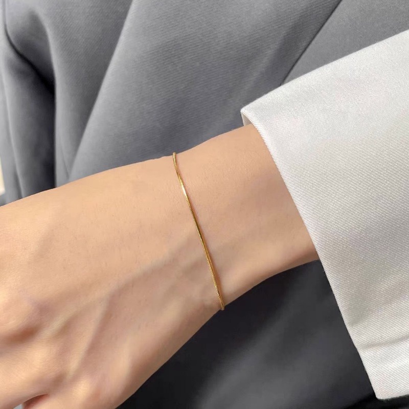 สร้อยข้อมือเหล็กไทเทเนียม รูปกระดูกงู สีทอง เครื่องประดับแฟชั่น สําหรับผู้หญิง