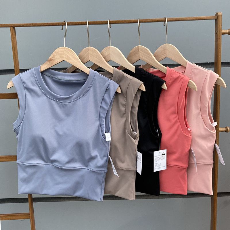 เสื้อกล้ามแขนกุด พร้อมแผ่นรองหน้าอก สีพื้น เหมาะกับใส่ออกกําลังกาย เล่นโยคะ วิ่งกลางแจ้ง แฟชั่นฤดูร้อน สําหรับผู้หญิง