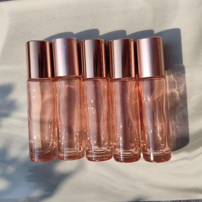 ขวดแก้วใส่น้ําหอม น้ํามันหอมระเหย ขนาด 5 มล. 10 มล. พร้อมลูกกลิ้งเหล็ก สีชมพูกุหลาบ สําหรับเดินทาง
