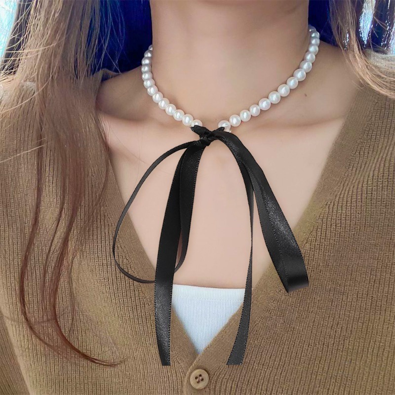 สร้อยคอโชคเกอร์ ประดับโบว์ ริบบิ้น มุกเทียม สีดํา หรูหรา อินเทรนด์เรียบง่าย สําหรับผู้หญิง 1 ชิ้น