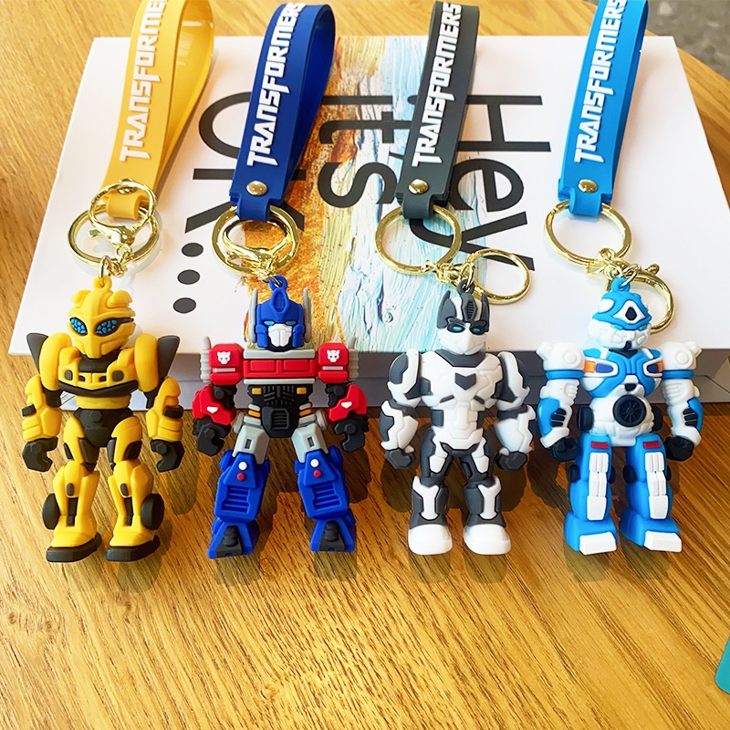 พวงกุญแจ จี้ตุ๊กตาหุ่นยนต์ Transformers Optimus Prime Bumblebee สร้างสรรค์ สําหรับกระเป๋านักเรียน