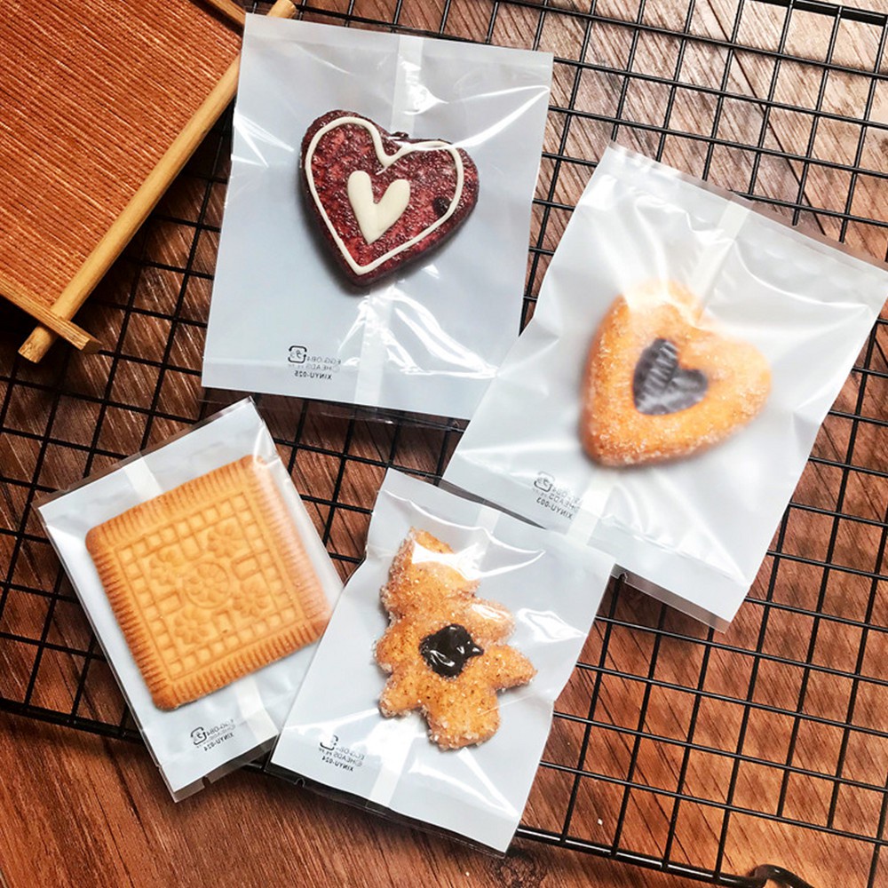 ถุงขนมคุกกี้ ซีลกลาง หน้าใสหลังขาว  ลาย 2524 (แพ็ค 100) ขนาด 5.5x8.5cm