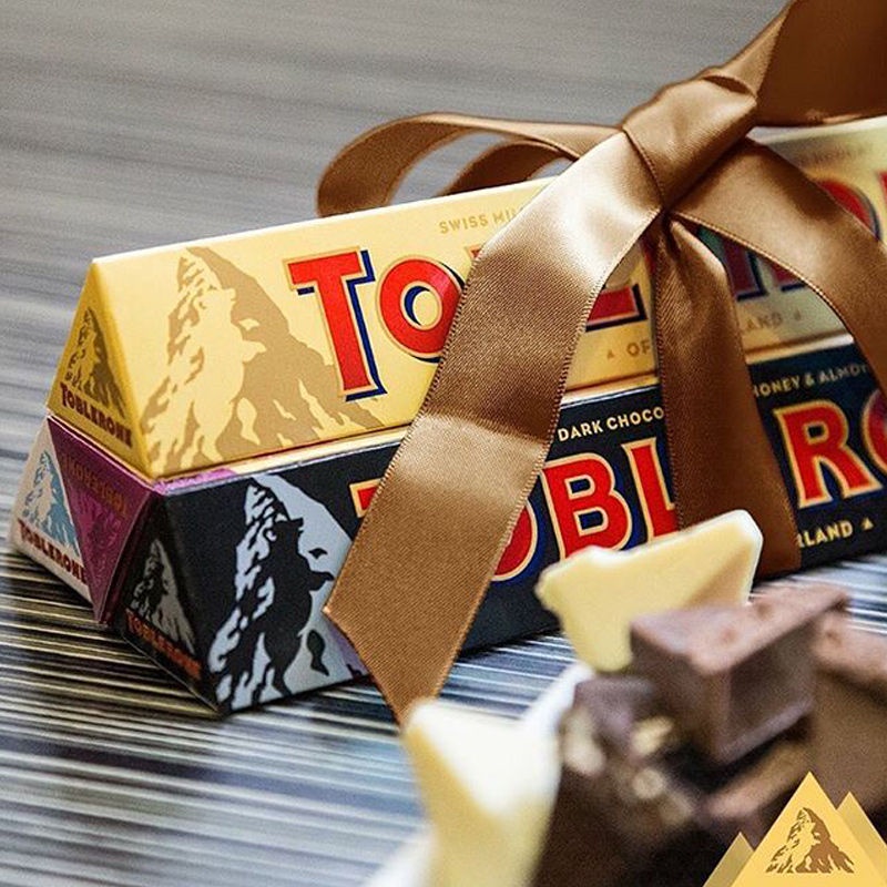 Mondelez นำเข้าสวิส Toblerone สามเหลี่ยม 100 กรัม * 4 ช็อคโกแลตสีดำช็อคโกแลตสีขาวช็อคโกแลตนมขนมของแ