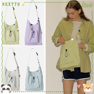 Nextth กระเป๋าสะพายไหล่ ผ้าไนล่อน ทรงบักเก็ต สีพื้น น้ําหนักเบา สไตล์เรียบง่าย สําหรับผู้หญิง