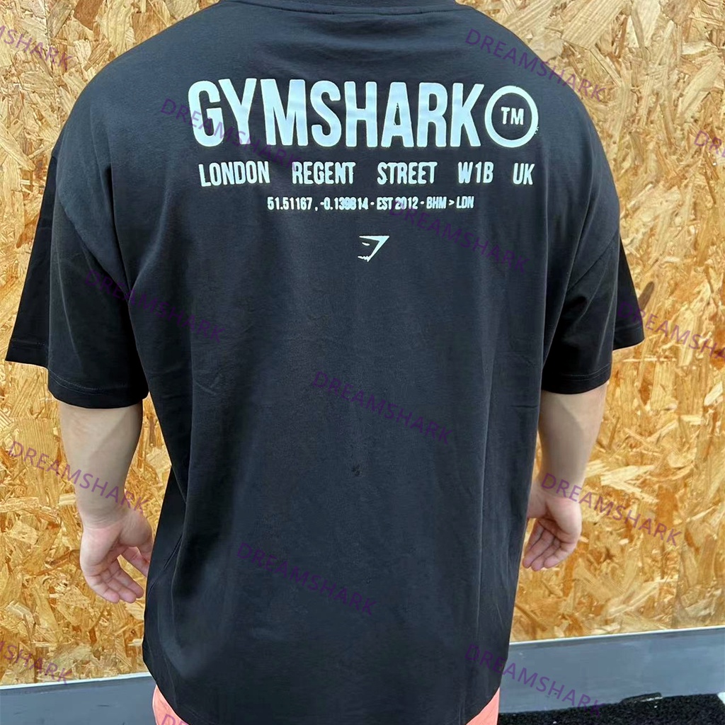 พร้อมส่ง GYMSHARK เสื้อยืด ผ้าฝ้ายแท้ พิมพ์ลาย ทรงหลวม สําหรับผู้ชาย และผู้หญิง