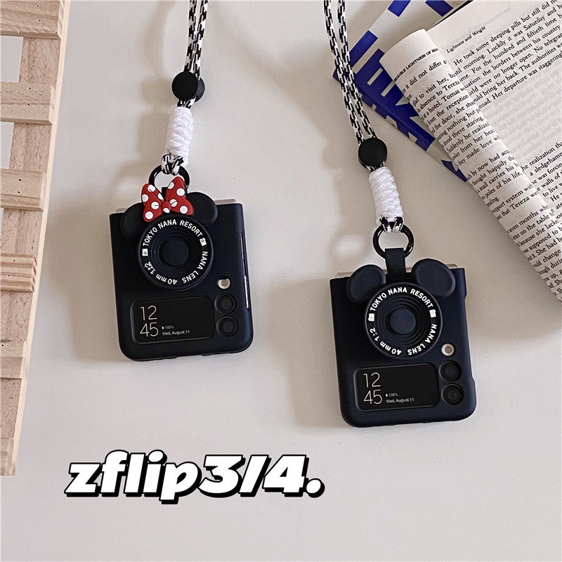 SAMSUNG แฟชั่นสีทึบมิกกี้มินนี่สายคล้องมือสีดําเคลือบสําหรับSamsung Galaxy Z Flip 7 6 5 4 3 5G Zflip7 zflip6 zflip5 หรูหราแบบพกพาโทรศัพท์แหวนปก