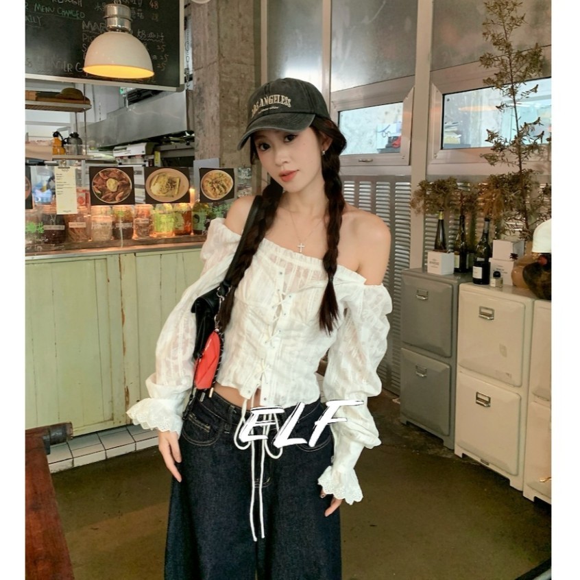 ELFwoo เสื้อลูกไม้ปักลายไหล่เดียวสีขาวสําหรับผู้หญิงอารมณ์อเนกประสงค์เสื้อท่อนบน