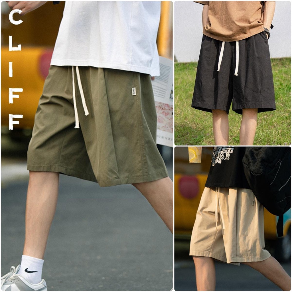 CLIFF กางเกงขาสั้น ผู้ชาย เอวยางยืด หลวม เชือกสาน การตกแต่งฉลากขนาดเล็ก แนวโน้มบุคลิกภาพ Black Casual