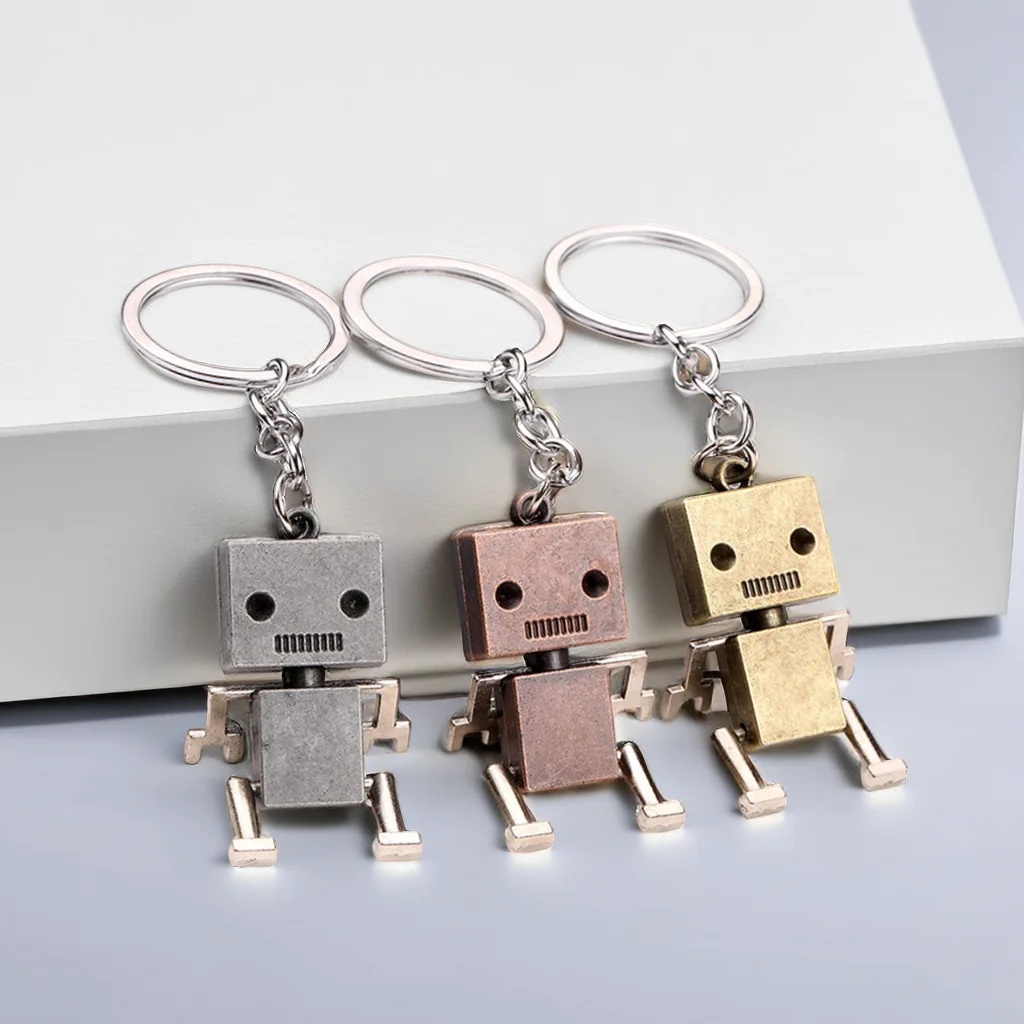 พวงกุญแจโลหะ จี้การ์ตูนหุ่นยนต์ สร้างสรรค์ ของขวัญวันเกิด สไตล์เรโทร สําหรับผู้ชาย และผู้หญิง