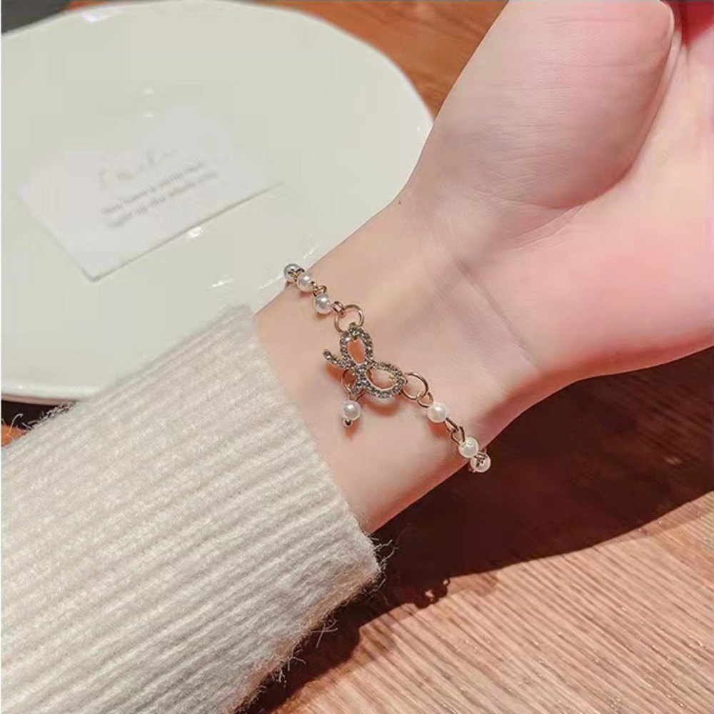 สร้อยข้อมือมุก จี้รูปโบว์ประดับเพชร กำไลข้อมือ สร้อยข้อมือไข่มุก เครื่องประดับผู้หญิง แฟชั่น สไตล์เกาหลี B22 - รูปที่ 3