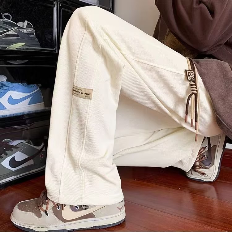 กางเกงวอร์มขากว้างลําลอง ทรงหลวม แนวตรง สไตล์อเมริกัน สตรีท เหมาะกับฤดูใบไม้ผลิ และฤดูใบไม้ร่วง สําหรับผู้ชาย