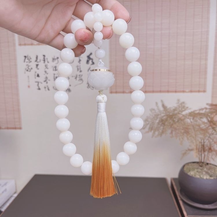 ต้นฉบับสีขาวโพธิ์รากหินส่องสว่างซองมือถือผู้ชายผู้หญิงพุทธสวดมนต์ลูกปัดพู่สร้อยข้อมือของขวัญ