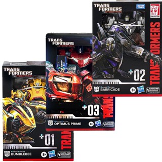 Hasbro Transformers ของเล่น WFC Optimus Prime Megatron Bumblebee Barricade Flying over the Mountain YZQG