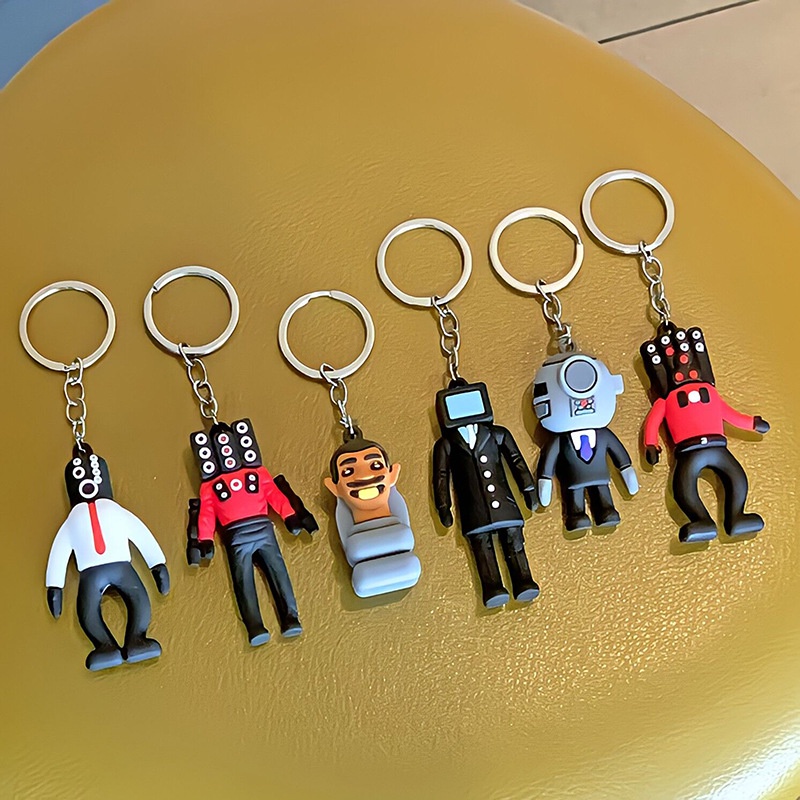 พวงกุญแจ จี้ตุ๊กตาคนชักโครก PVC ยางนิ่ม รูปการ์ตูนคนเสียง สร้างสรรค์ สําหรับห้อยกระเป๋า