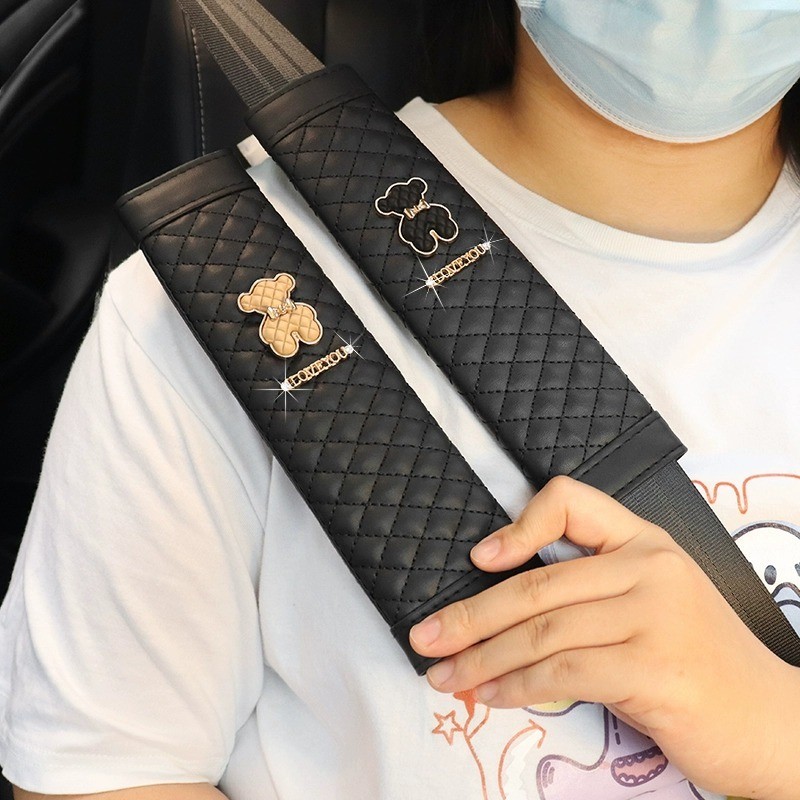 2ชิ้นรถที่นั่งเข็มขัดไหล่แผ่นน่ารักหมีหนังประกันรถยนต์เข็มขัดฝาครอบป้องกันเด็กรถไหล่แผ่นตกแต่ง
