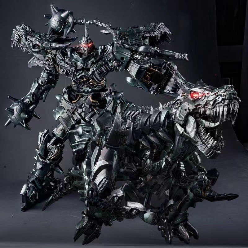 เปลี่ยนของเล่นสายเหล็ก Tyrannosaurus Rex ไดโนเสาร์โลหะผสม Megatron Optimus Pillar Bumblebee Boy รุ่น